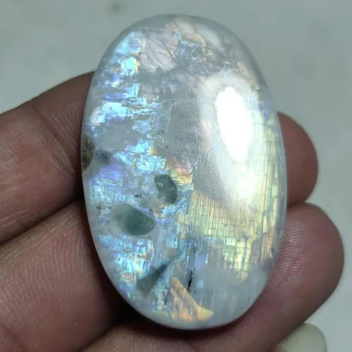 Close-up demonstrating adularescence movement in moonstone