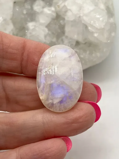 Comparison of low vs high quality moonstones showing adularescence differences