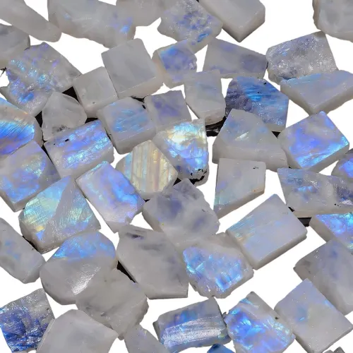 Person tilting moonstone to show adularescence