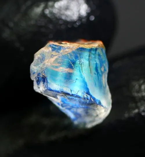 Side-by-side comparison of blue moonstone and rainbow moonstone