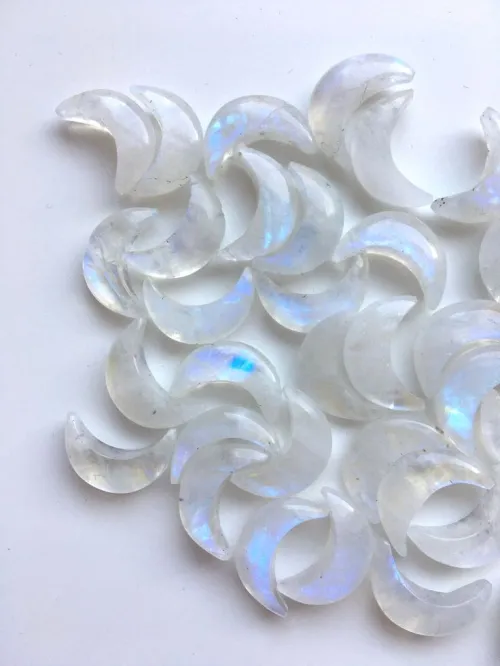Visual comparison of high and low quality moonstone rings under light